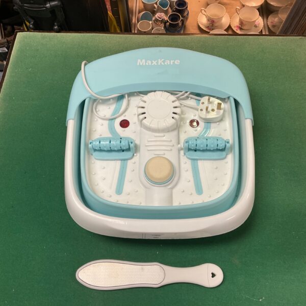 MaxKare foot massager with control panel and splash guard.
