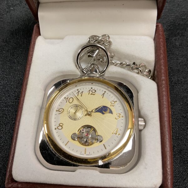 Gold mechanical pocket watch with moon phase complication and chain.