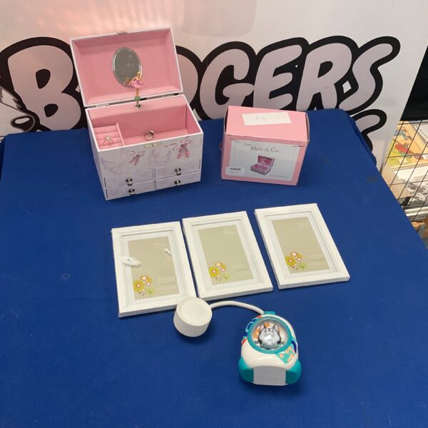 Charming Mele & Co musical jewellery box with fairy design and photo frames.