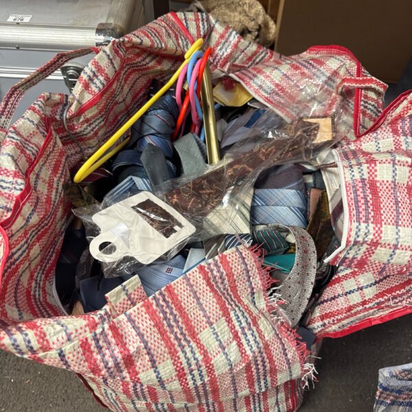 Large lot of assorted men's ties in various colours and patterns.