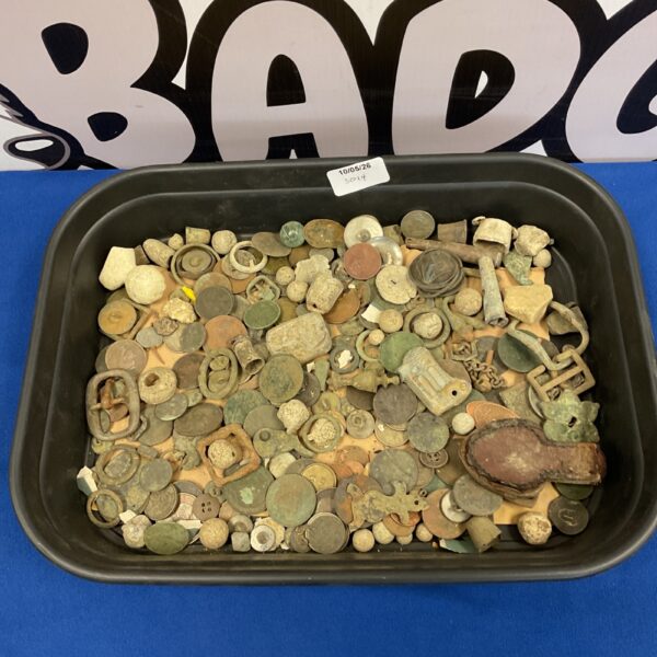 Mixed lot of metal detector finds including coins and buckles.