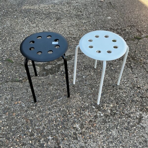 Pair of vintage metal and plastic stools with circular seats.