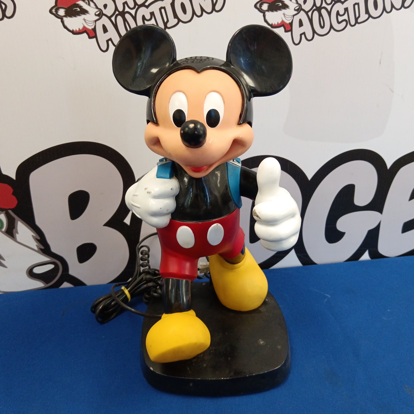 Vintage Mickey Mouse telephone with a bright red and black design.