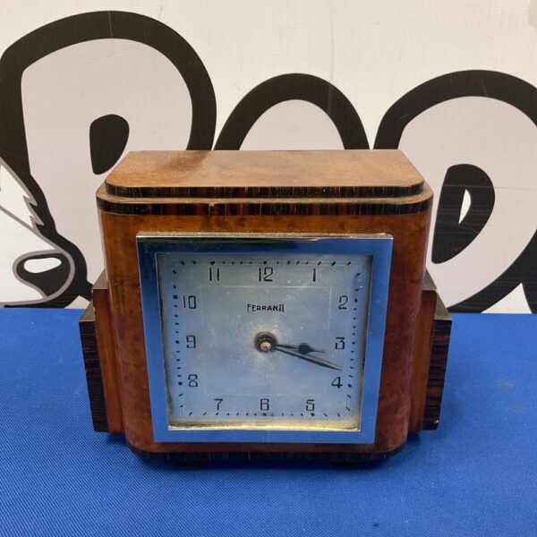 Vintage mid-century Ferranti electric mantle clock on display.