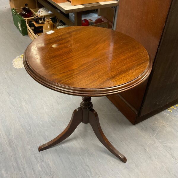 Vintage mid-century oak pedestal table with curved legs.