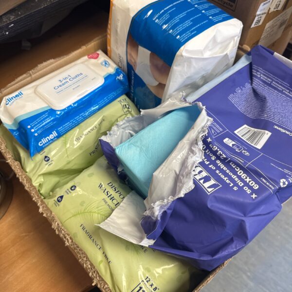 Mixed care lot including incontinence pants and cleaning cloths.