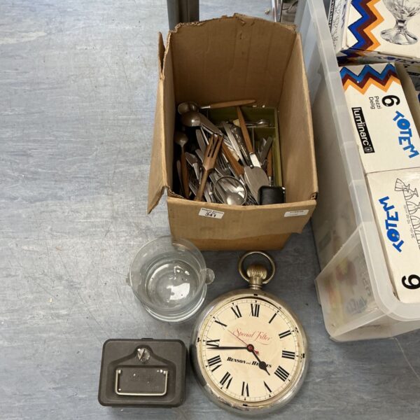 Mixed cutlery lot with stainless steel utensils and other items.