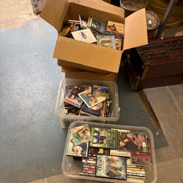 Mixed lot of DVDs and CDs in cardboard boxes, ready for a new home.