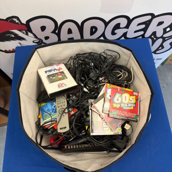 Mixed electronics lot featuring a Sega Mega Drive game and various cables.
