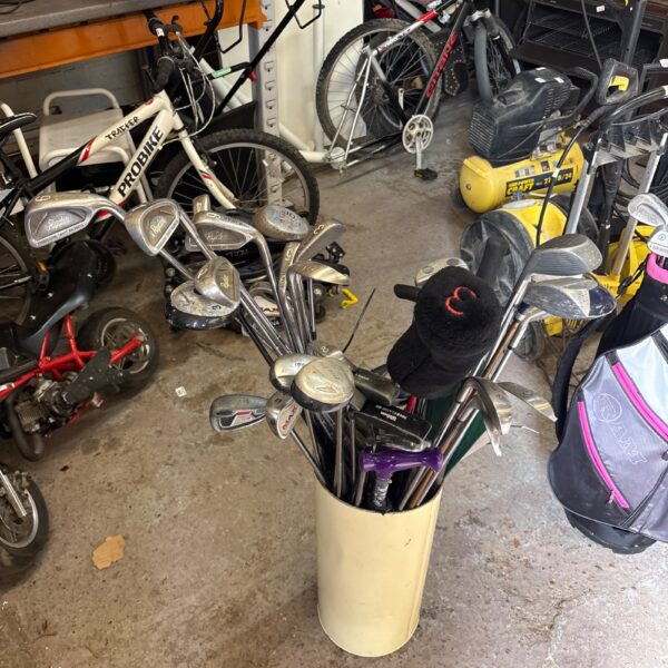 Mixed selection of vintage golf clubs including Dunlop and Wilson brands.