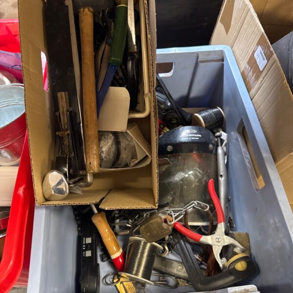 Mixed tool lot with hammers, pliers, and screwdrivers.