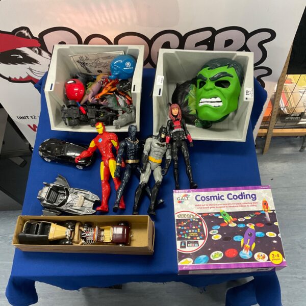 Mixed toy lot featuring superhero figures and a Hulk mask.