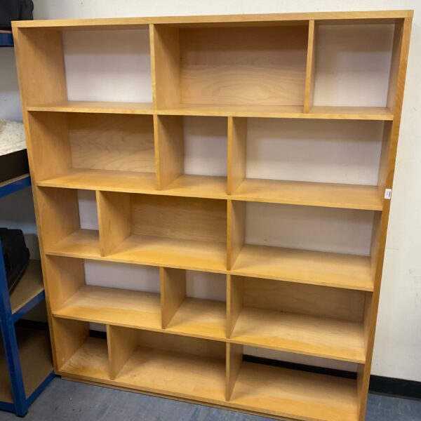 Large multi tier storage shelf unit with multiple compartments.