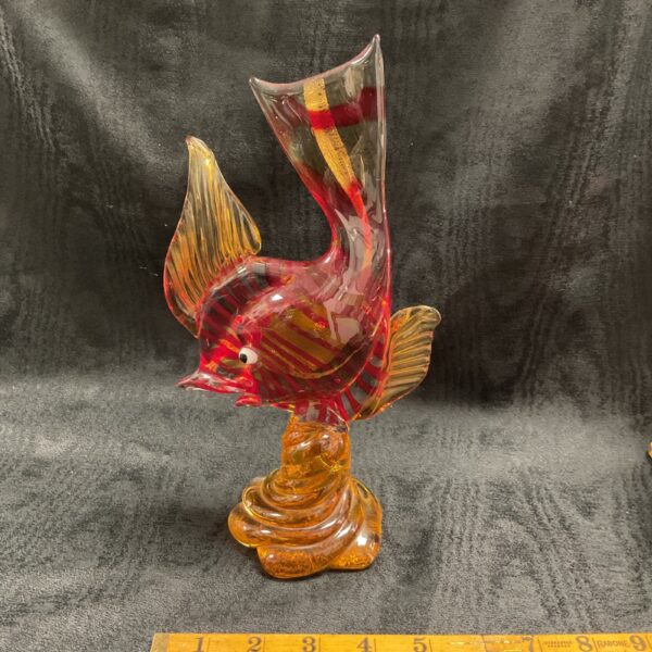 Vintage Murano glass fish sculpture with orange and amber hues.