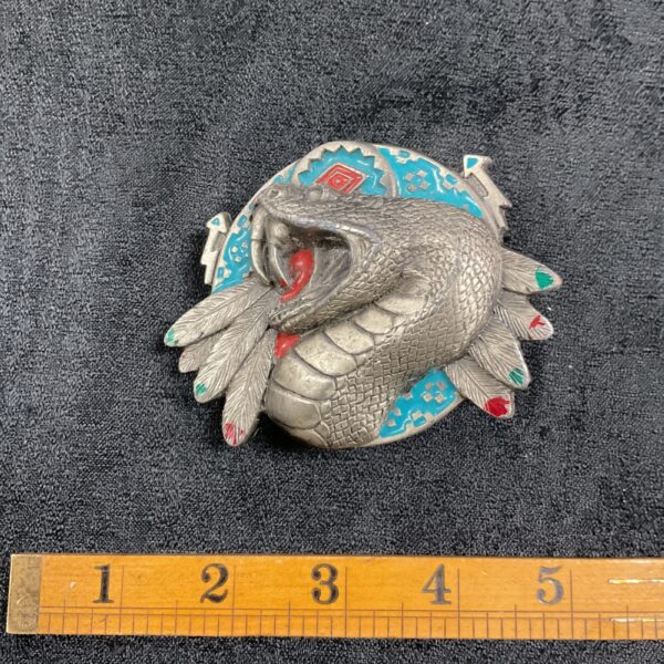 Detailed Native American rattlesnake belt buckle with turquoise and red enamel.