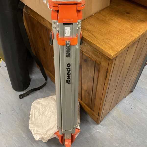 Nedo 249-20 surveying tripod with orange head and extended legs.