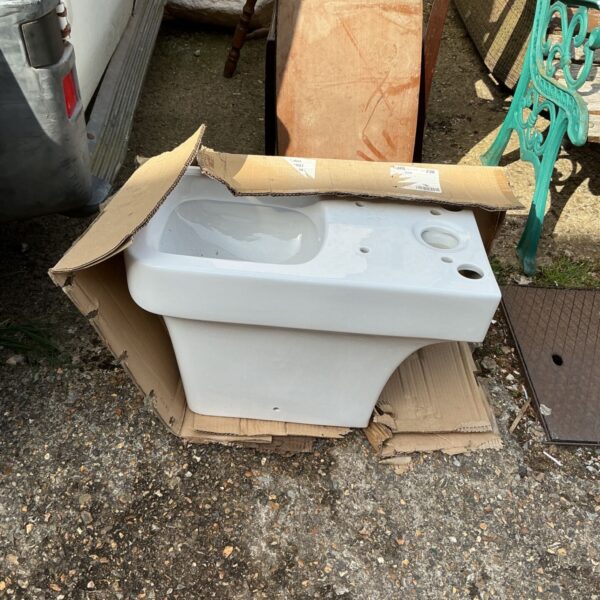 New white porcelain toilet bowl for bathroom renovation.