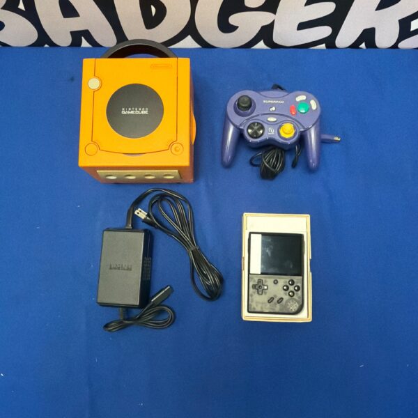 Orange Nintendo GameCube console with controller and Anbernic system.