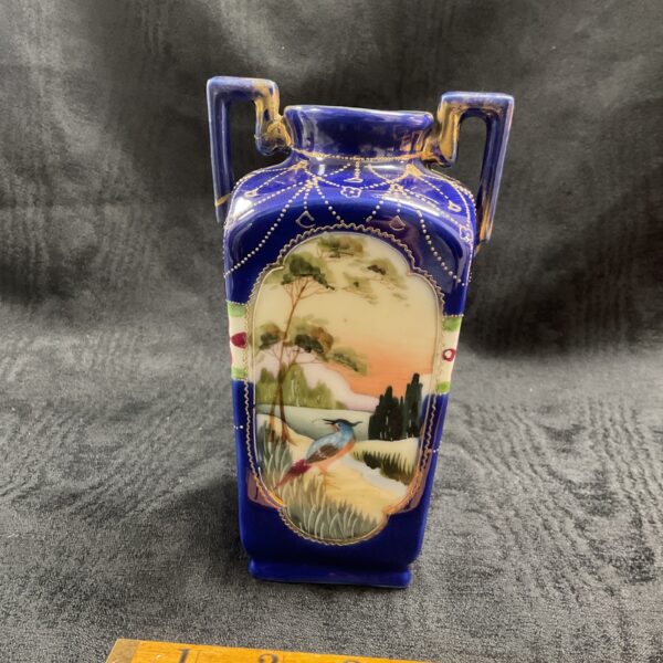 Antique Nippon Kinjo vase with hand-painted landscape scene.