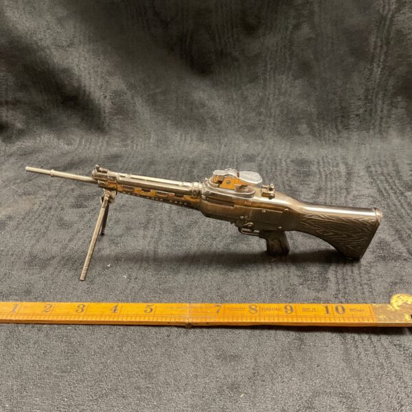 Vintage novelty rifle gas lighter, unique collectible item.