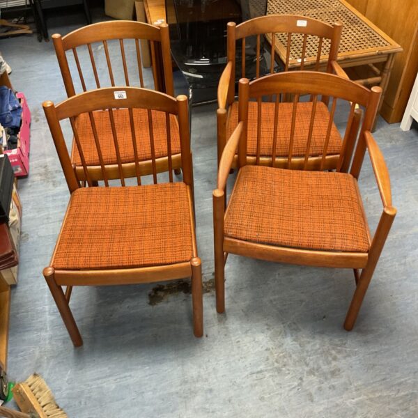 Vintage oak dining chair with orange upholstered seat.