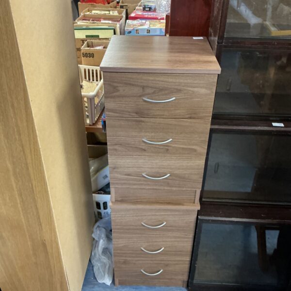 Pair of oak effect bedside cabinets for bedroom storage.