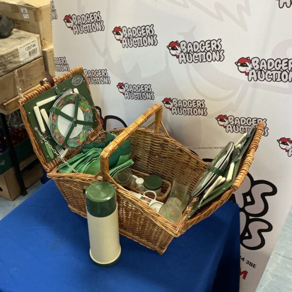 Vintage Optima wicker picnic basket with contents displayed.