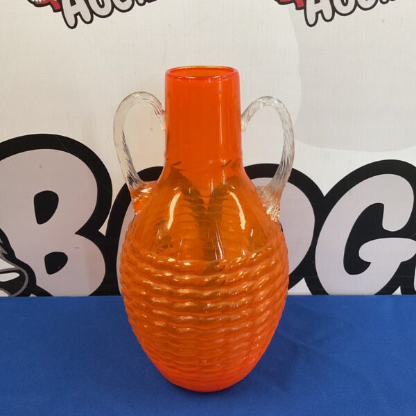 Vibrant orange art glass vase with twin handles.