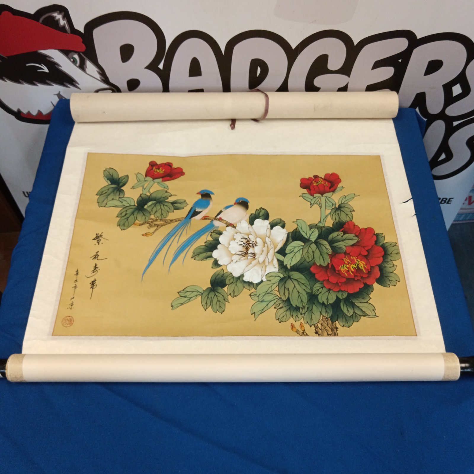 Vintage oriental bird painting on silk scroll with floral details.