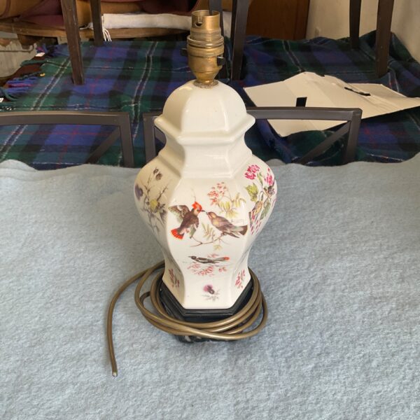 Vintage oriental table lamp with ceramic base and bird design.