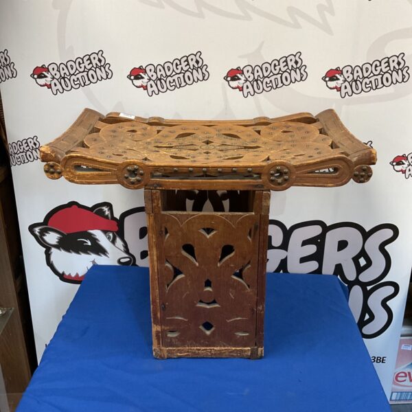 Intricately carved antique oriental temple stool with detailed wood work.