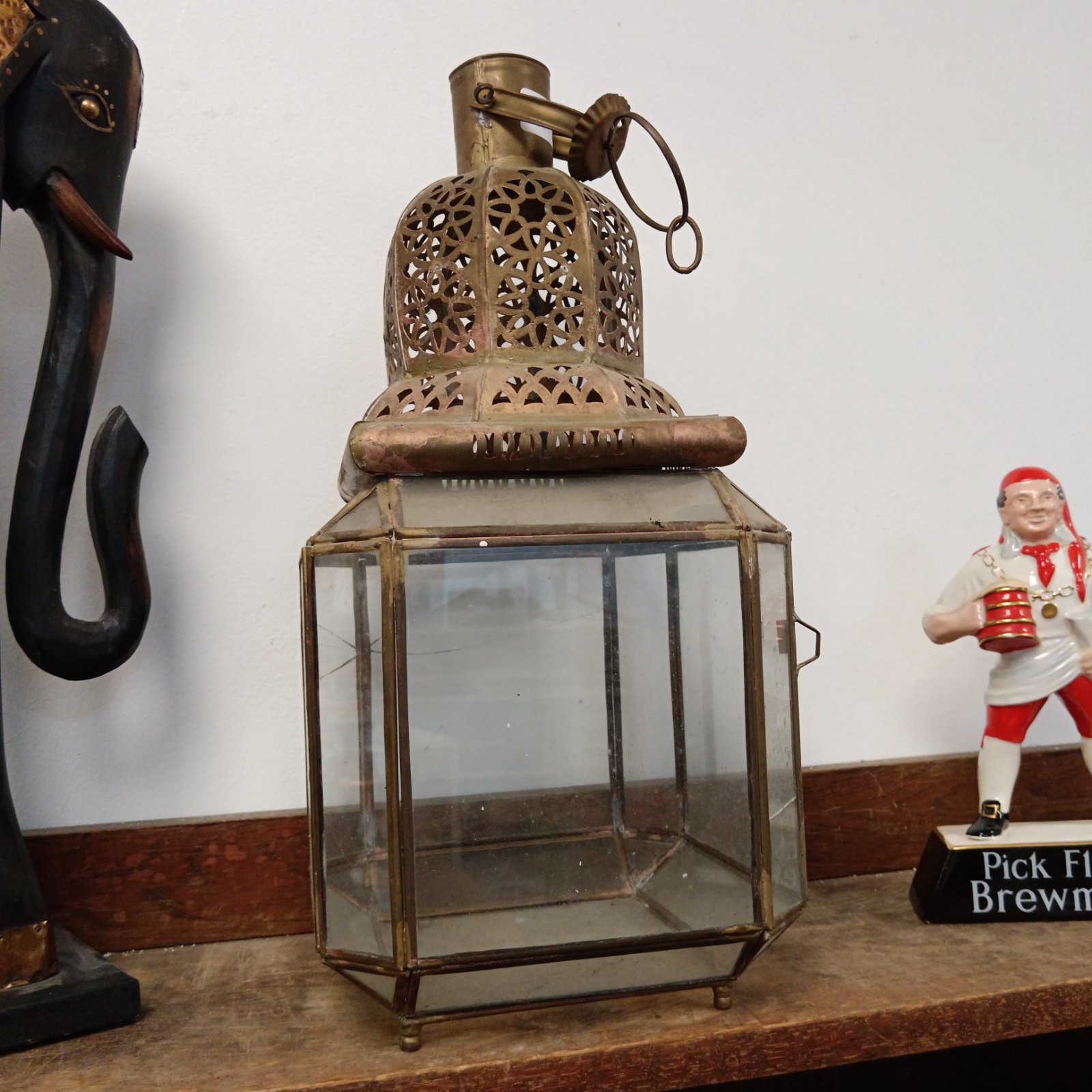 Antique Persian brass lantern with pierced design and glass panels.