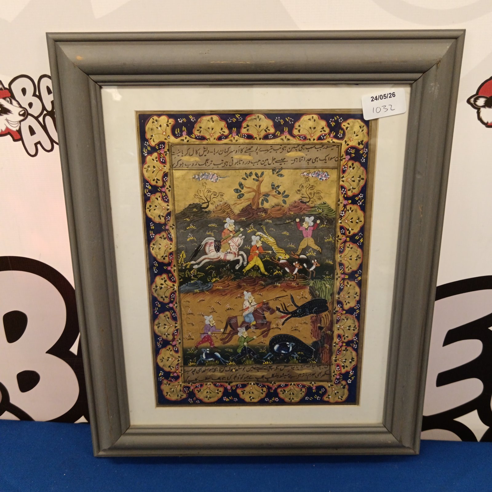 Framed vintage Persian hunt oil painting with equestrian scene.