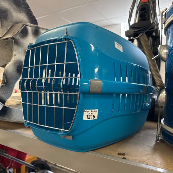 Blue plastic pet travel carrier for cats and small dogs.