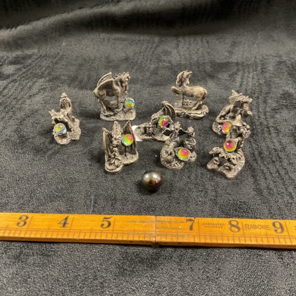 Detailed pewter myth and magic figures, collectible fantasy sculpture.
