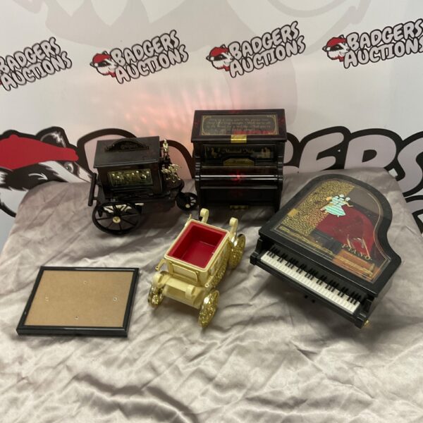Vintage piano and carriage music boxes, collectible antique items.