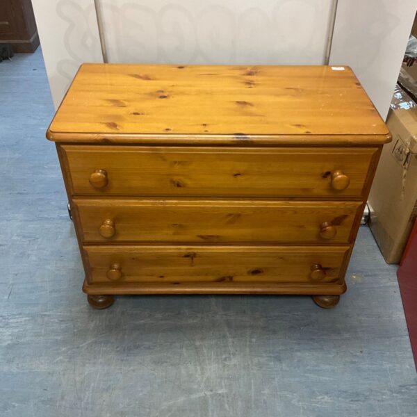 Vintage pine chest of drawers with three drawers.