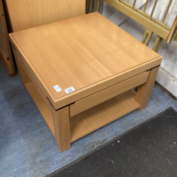 Rustic pine coffee table with lower shelf.