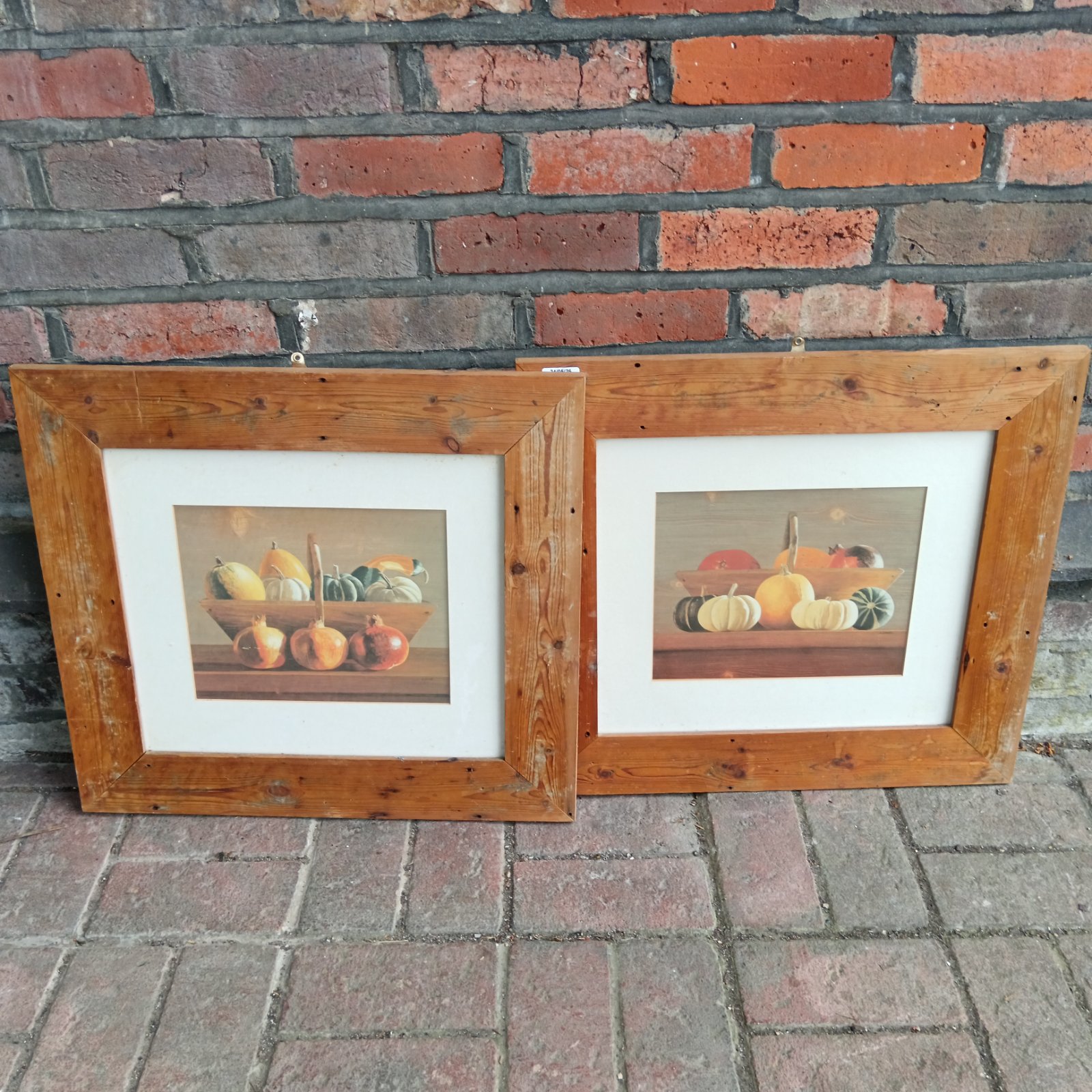 Pair of vintage still life prints in pine frames.