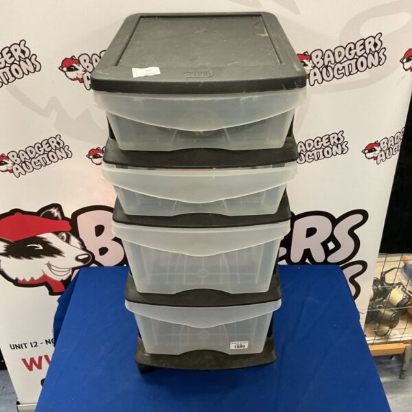 Black framed plastic storage tower with four clear drawers.