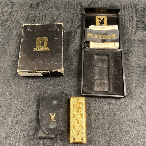 Vintage Playboy cigarette lighter in original packaging.