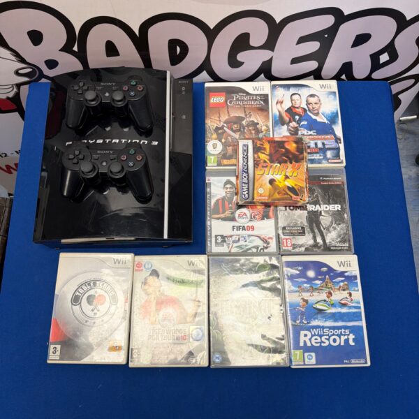 PlayStation 3 console bundle with controllers and games including Wii Resort.