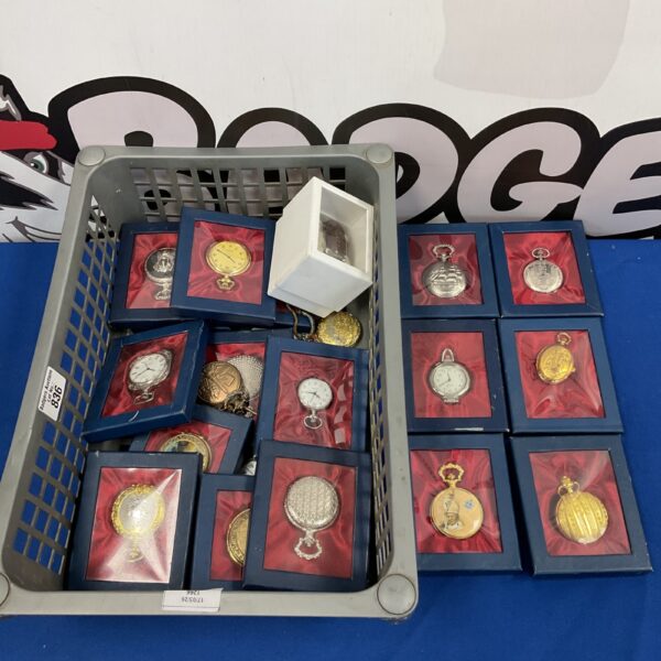 Collection of vintage silver-toned pocket watches in a plastic crate.
