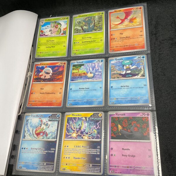 Pokemon card lot featuring cards from the Surging Sparks series.