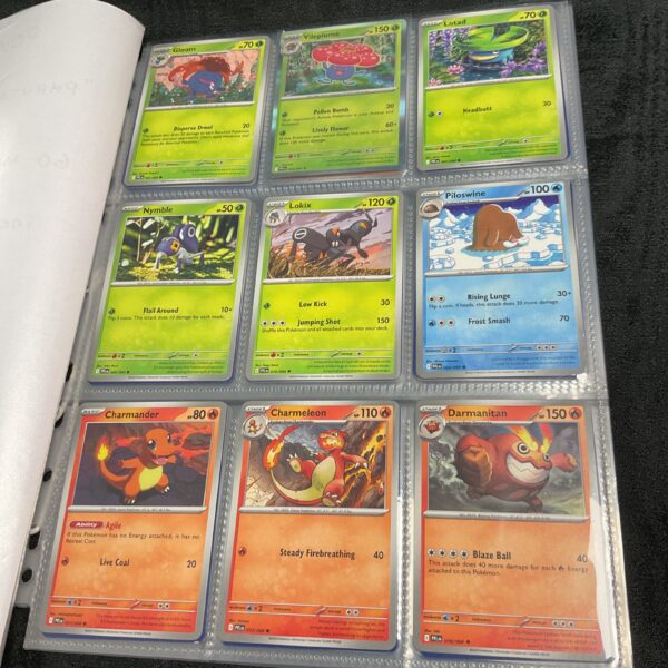 Pokemon card lot overview, featuring various cards from the Phantasmal Flames series.