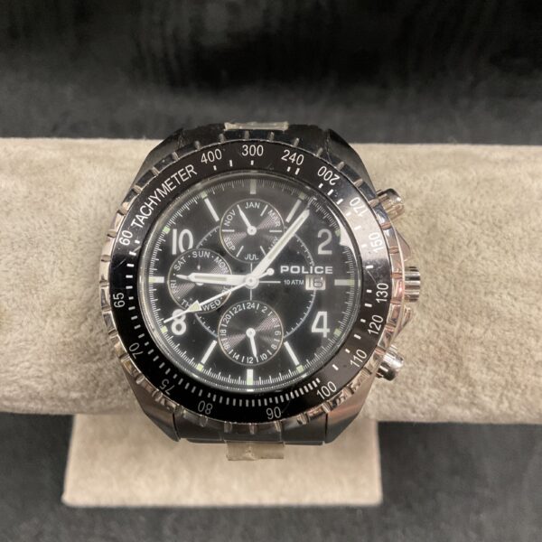 Close-up of a black dial Police quartz wristwatch with chronograph.