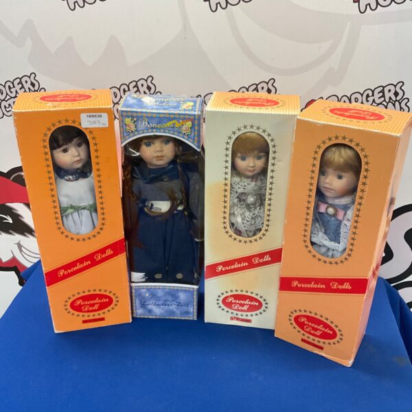 Four vintage porcelain collector dolls in a lot.