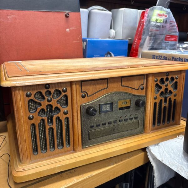 Vintage Prolextric stereo system with woodgrain finish.