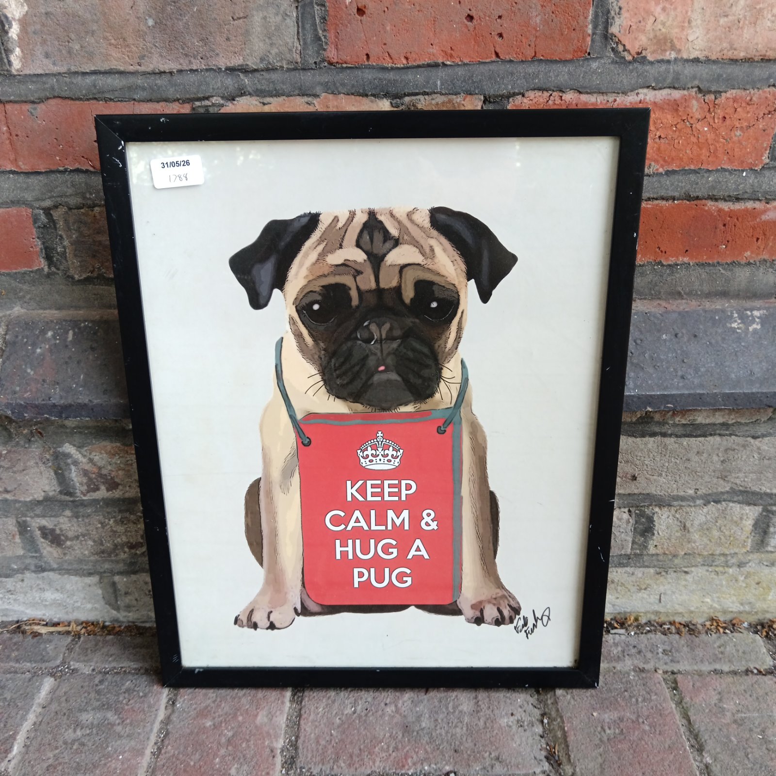 Framed "Keep Calm & Hug a Pug" print featuring a cute pug portrait.