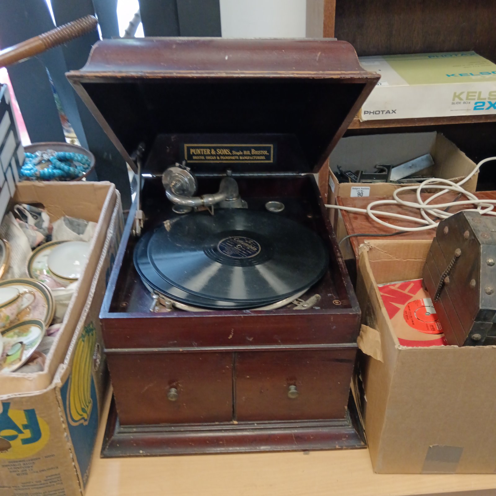 Antique Punter & Sons gramophone record player in wooden cabinet.